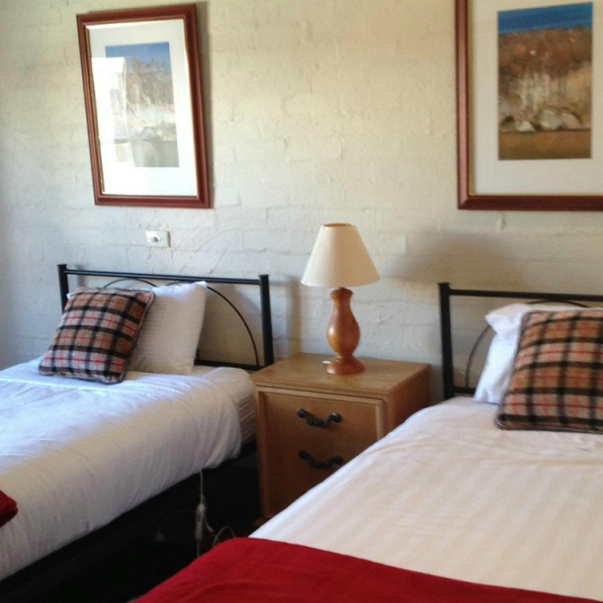 Second bedroom contains two king single beds