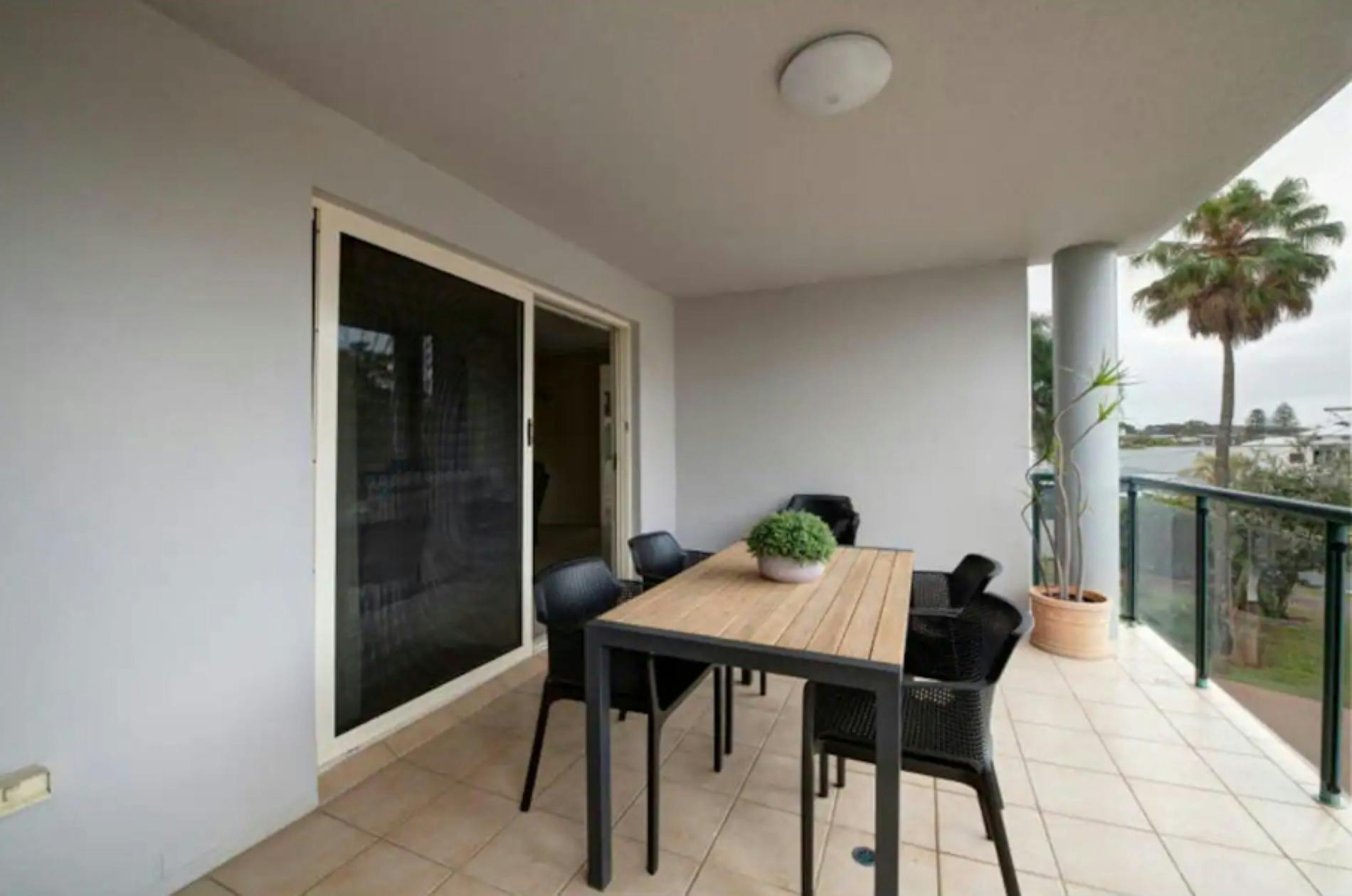 Balcony with 6 seater dining setting