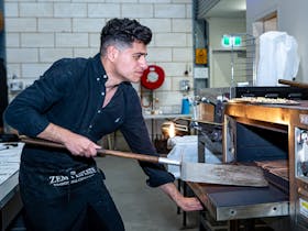Demetrio Zema cooking pizza at Zema Estate