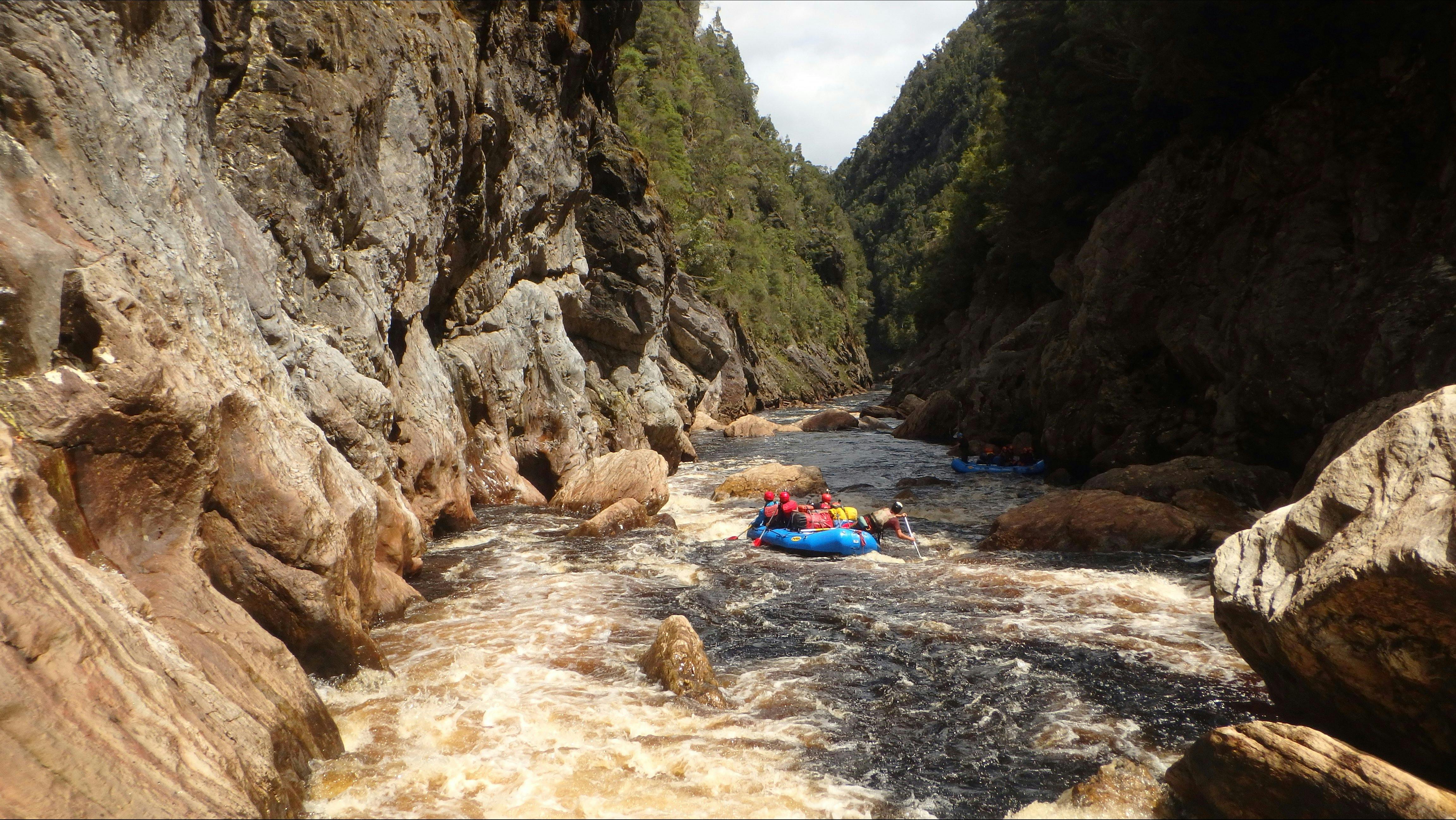 Raft running Thunderush rapid in the Great Ravine on the Franklin River