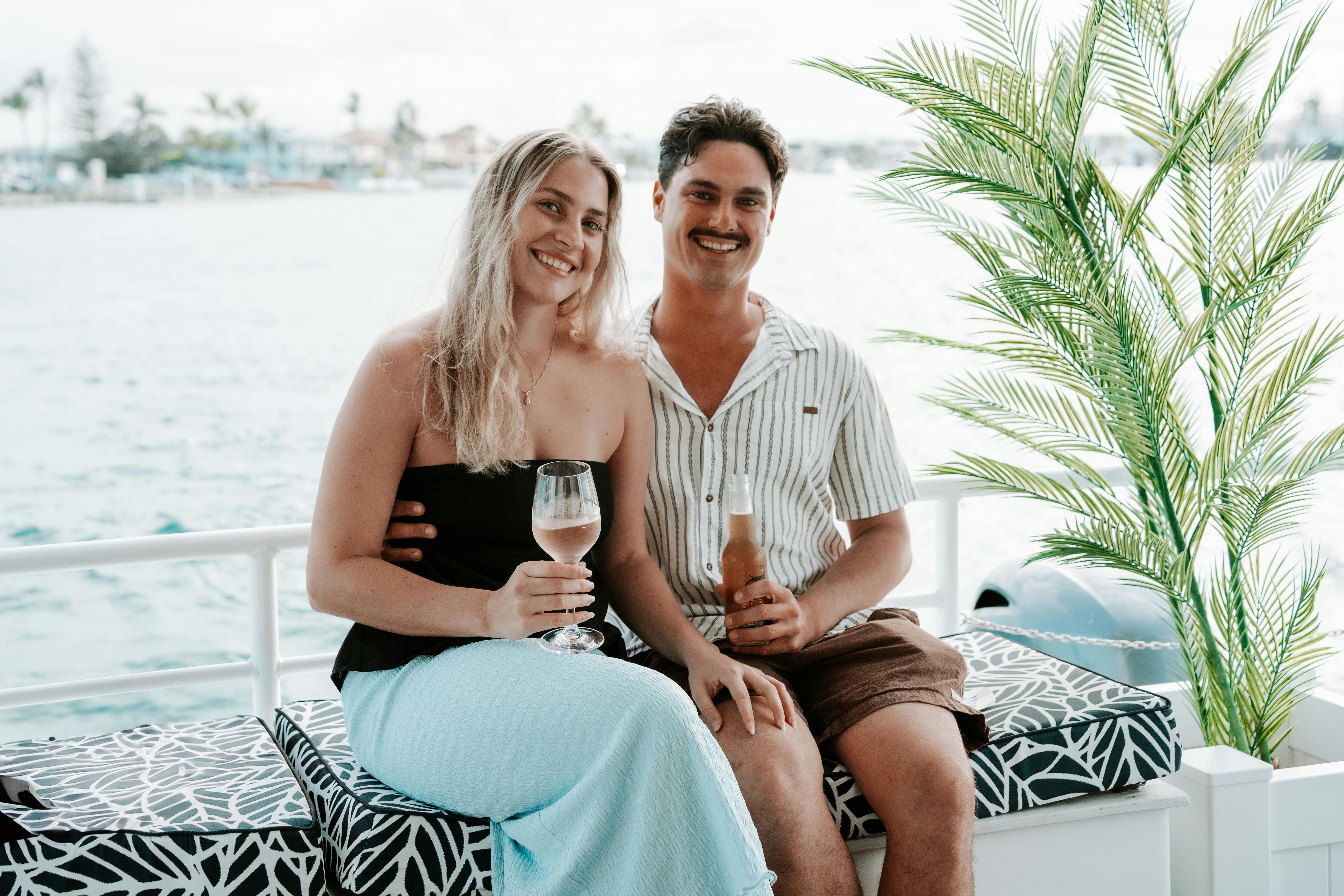 Happy Couple Enjoying a Beer and Wine onboard The Boat Mooloolaba