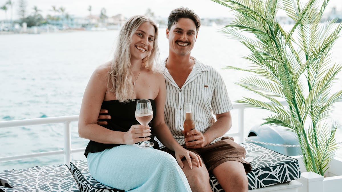 Happy Couple Enjoying a Beer and Wine onboard The Boat Mooloolaba