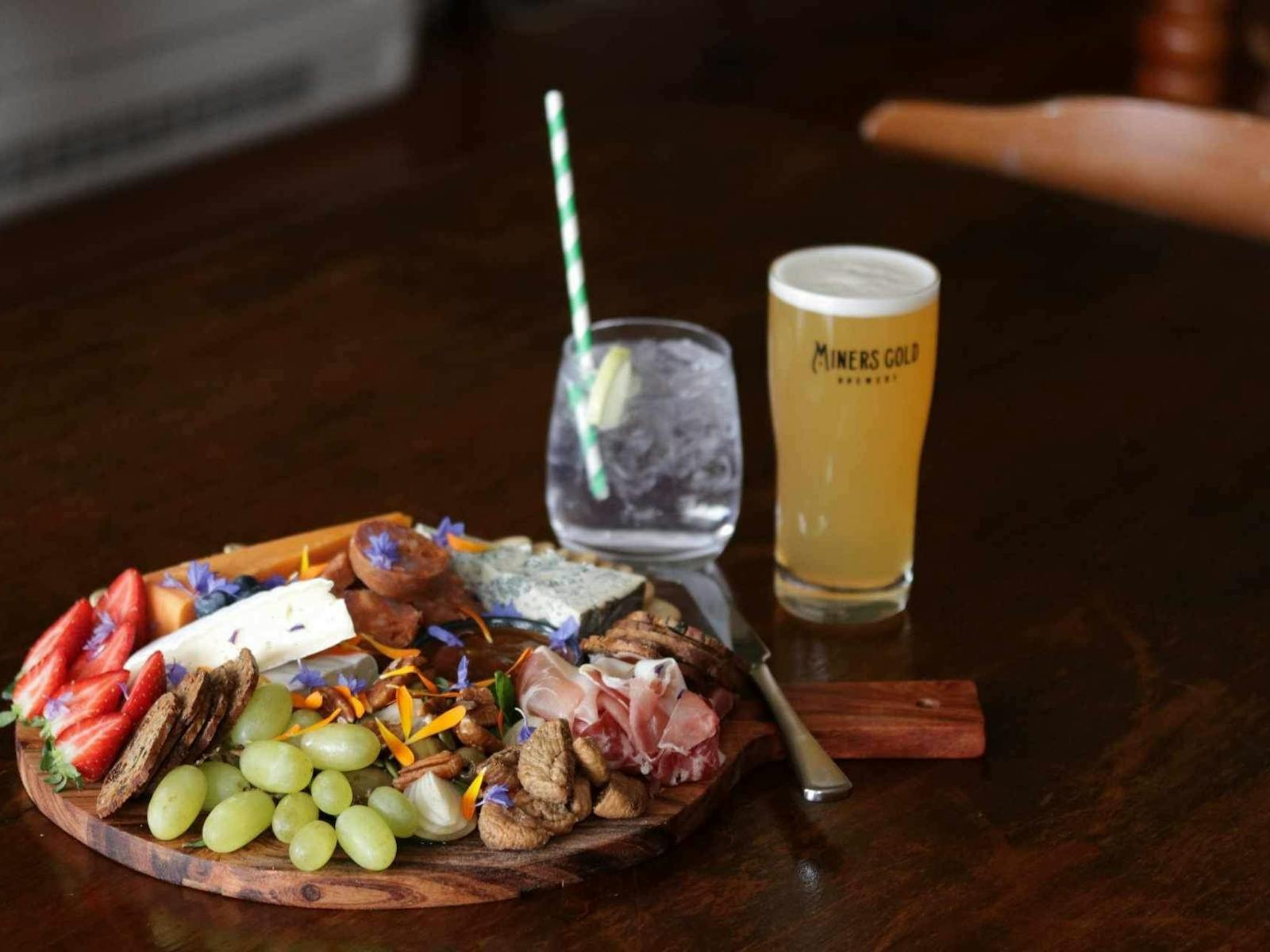 Photo of our cheese and meat platter and local craft beer