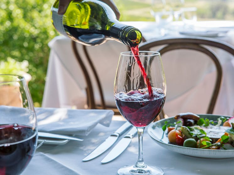 Glass of wine being poured at Bistro Molines, Hunter Valley