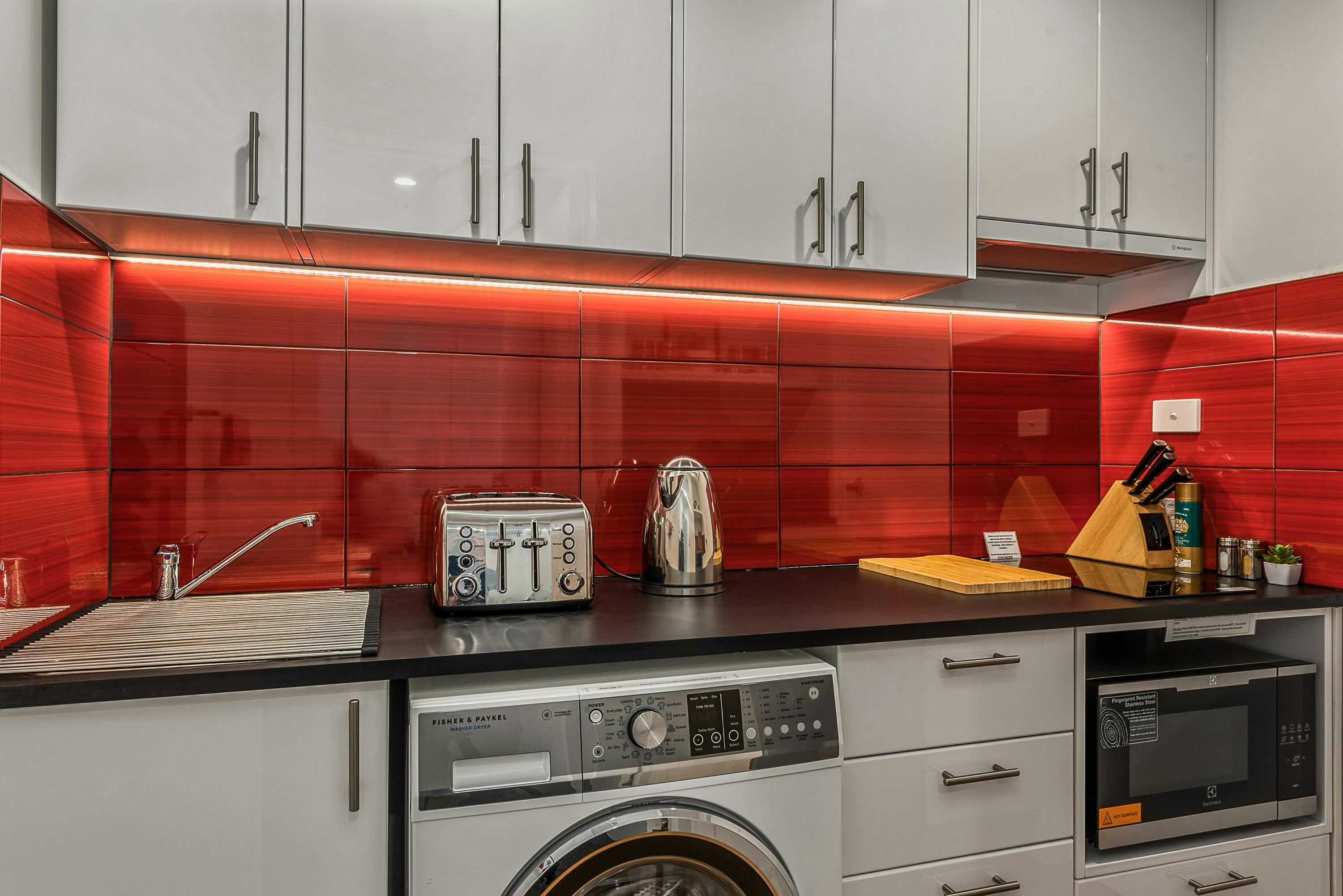 Compact galley kitchen with preparation space and cooking facilities