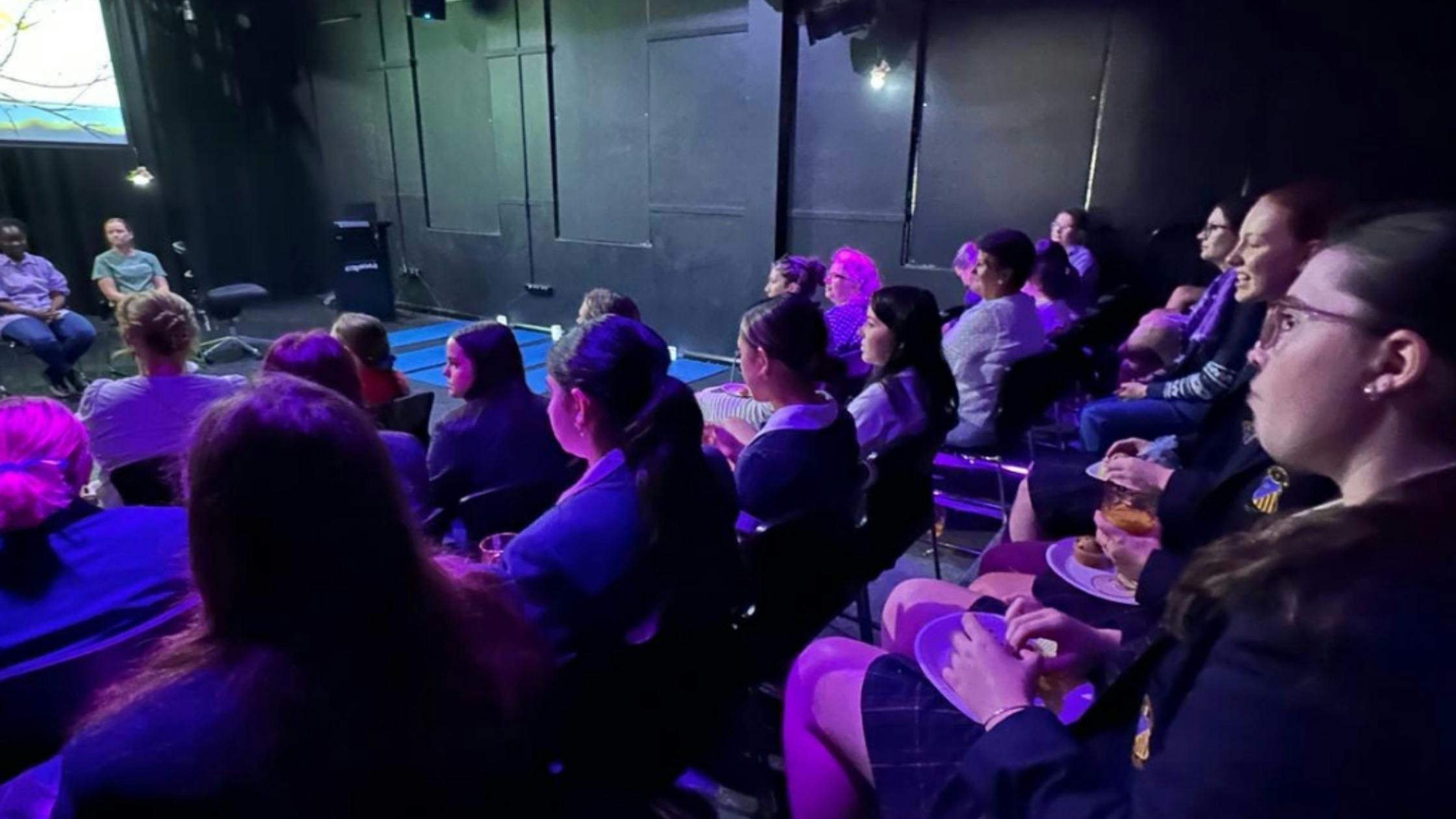 Audience attending a live discussion event
