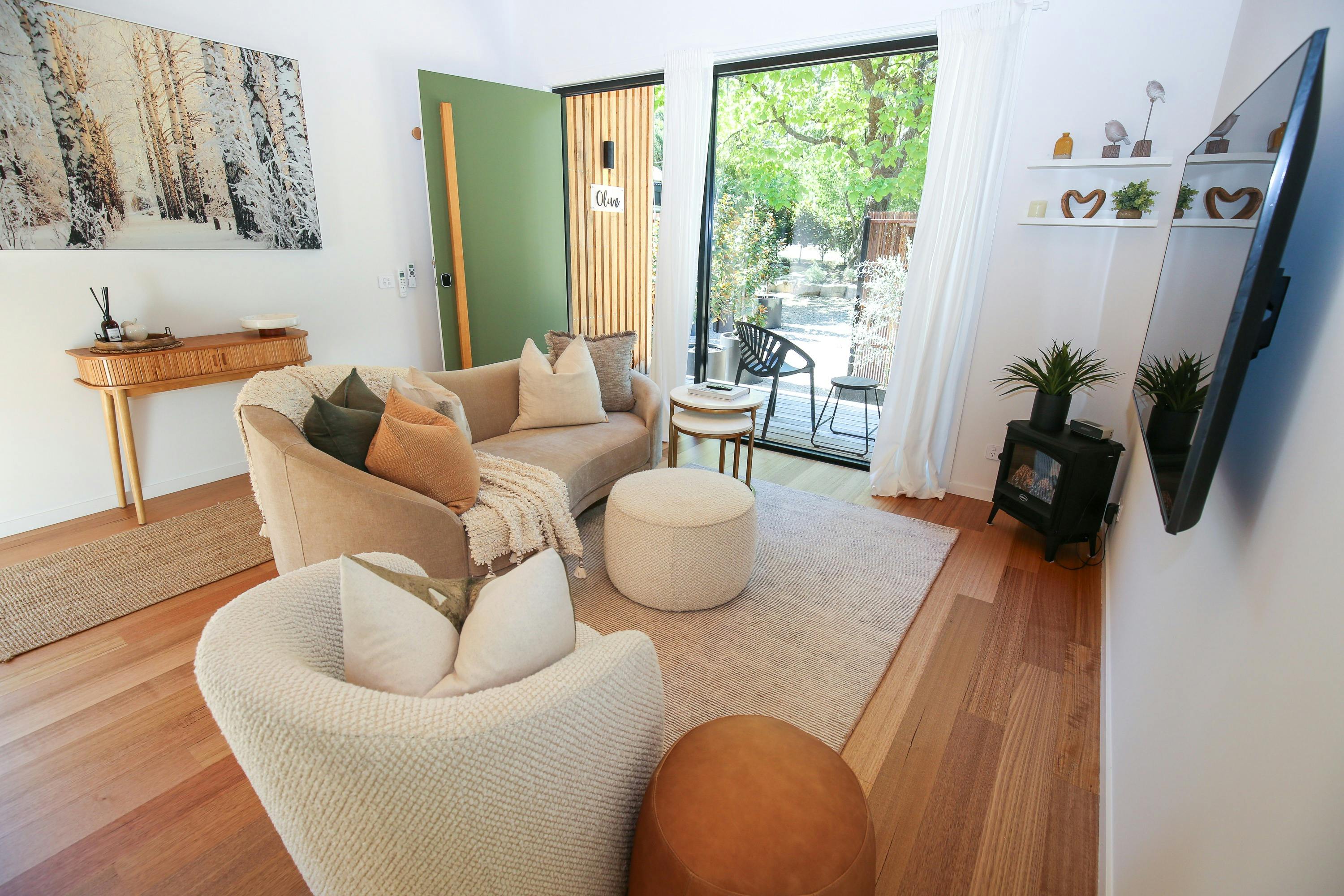 indoor living room space with couches and a tv