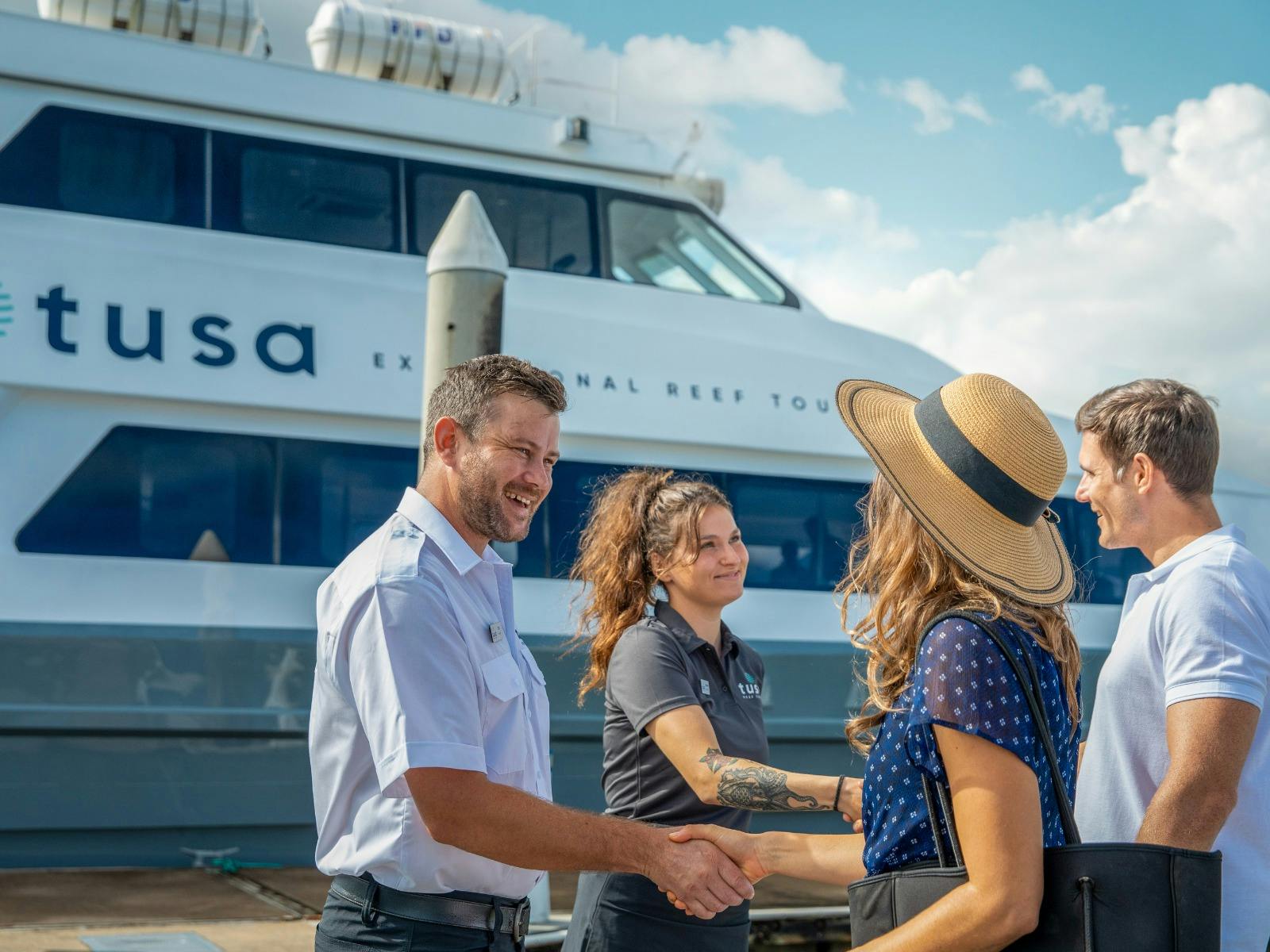 Tusa Reef Tours - Captain and crew welcoming guests onboard