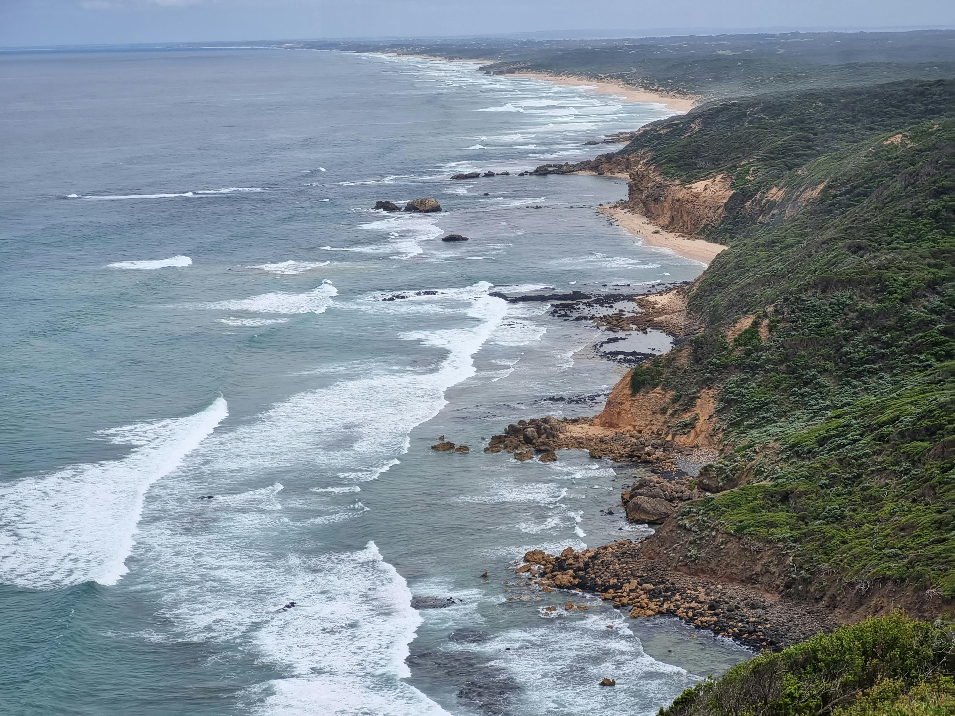 Golden beaches and spectacular cliffs  line the coast of the Mornington peninsula .