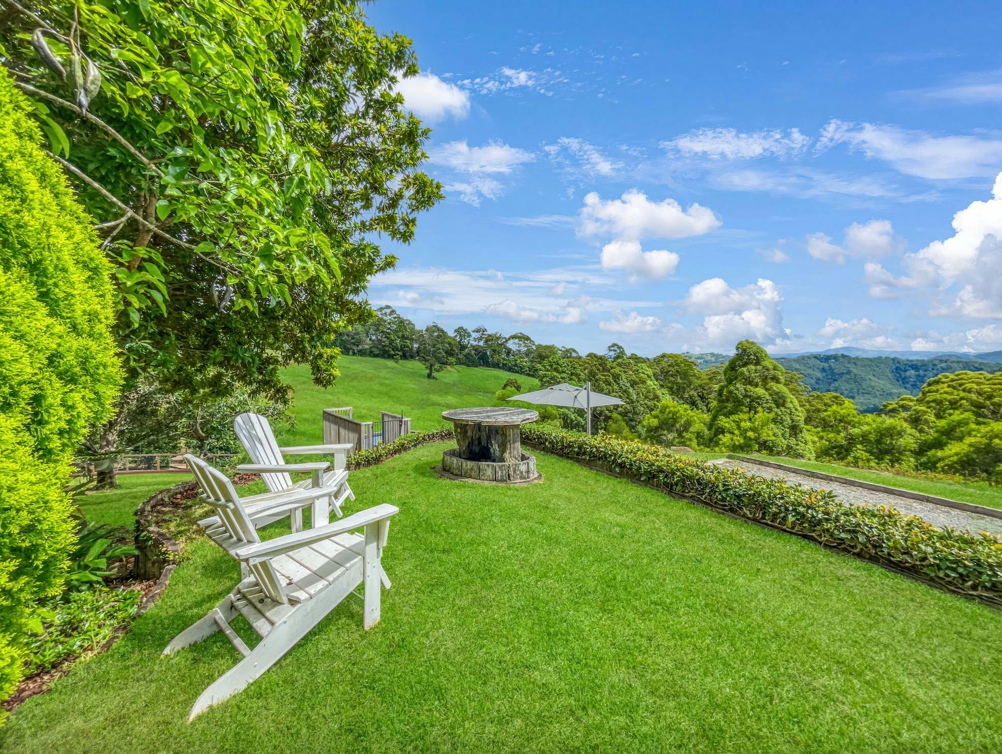 Escape to the secluded garden, surrounded by trees.