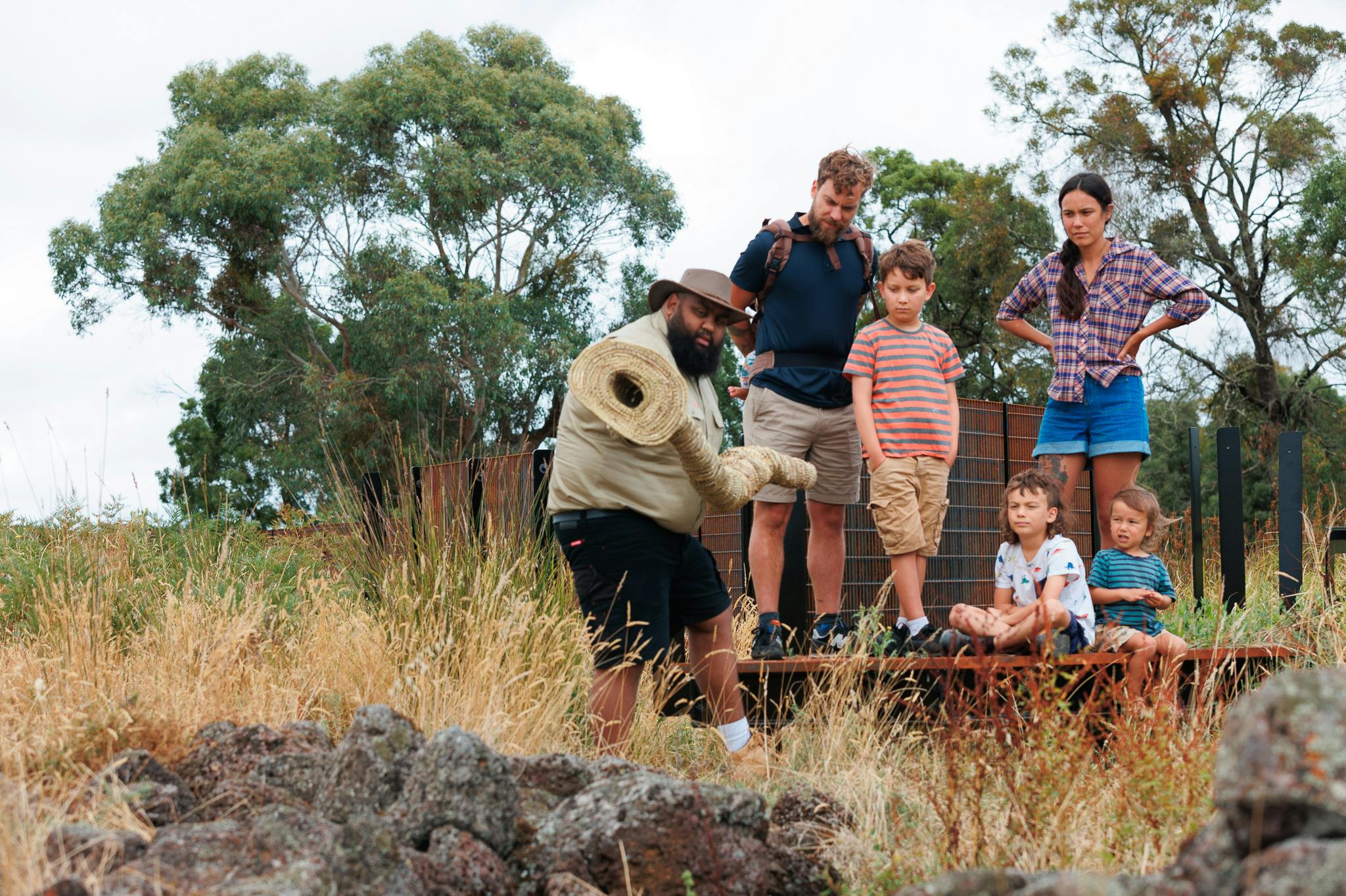 Aboriginal guide with eel basket