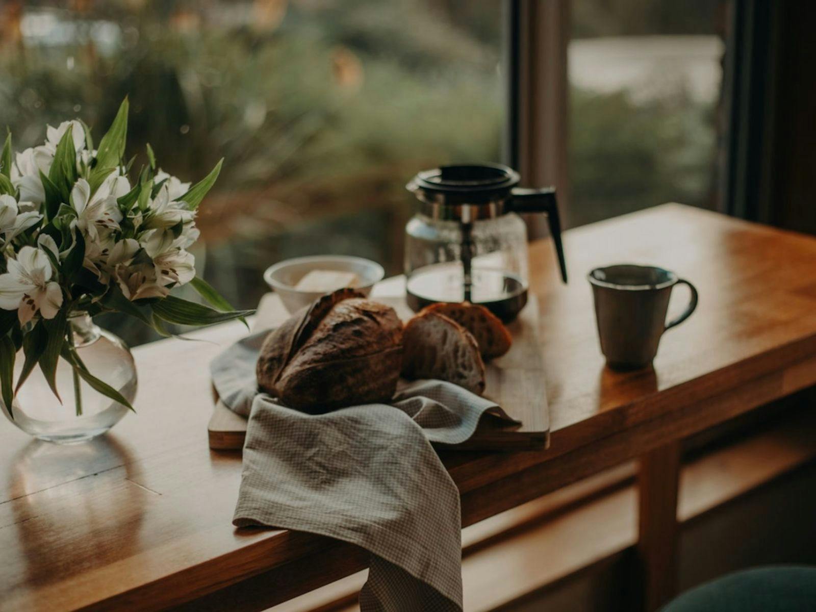 bread and flowers with coffee machine