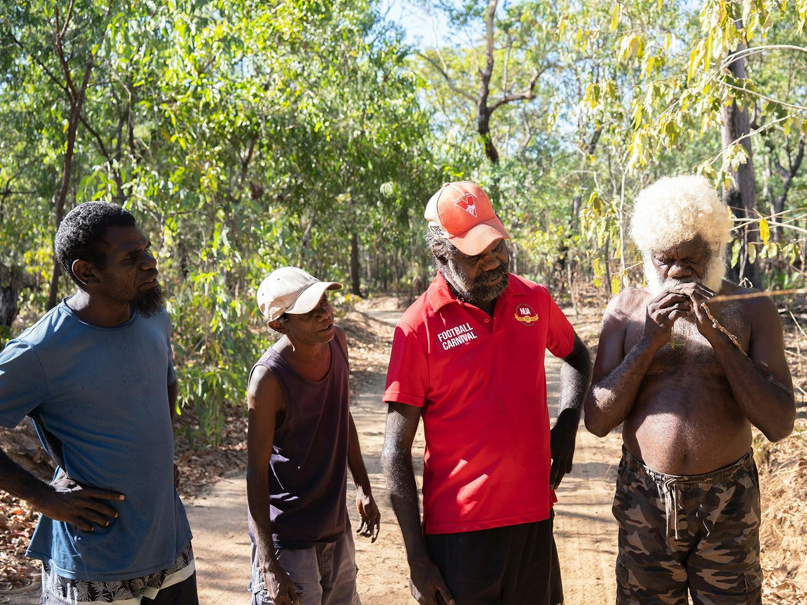 Teddy showing the men pwarlika, an enjoyable part of the medicine walk
