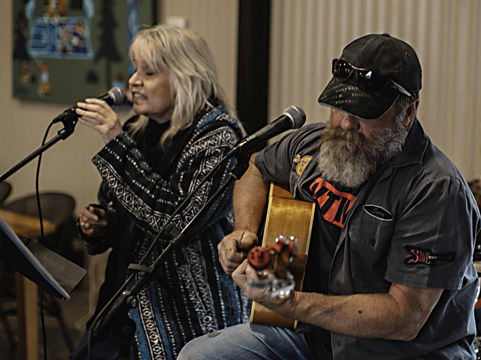 John & Jane Doe band playing music.