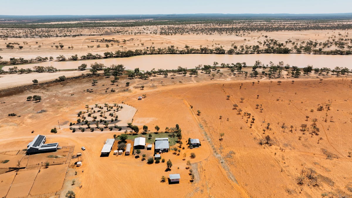 aerial view showing accommodation and lake