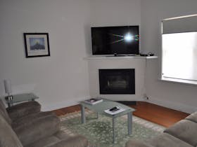 A comfortable TV room provides a relaxed setting.