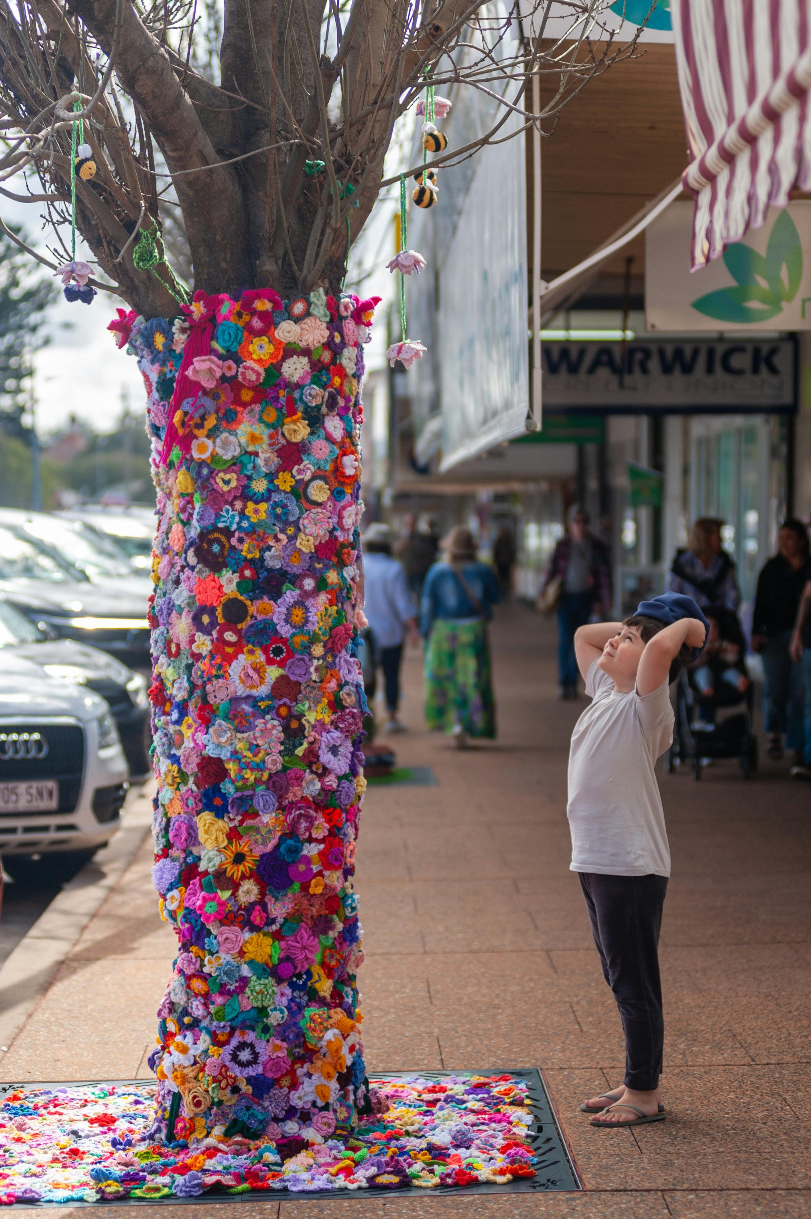 Child enjoying the wonder of the Tree Jumper installation
