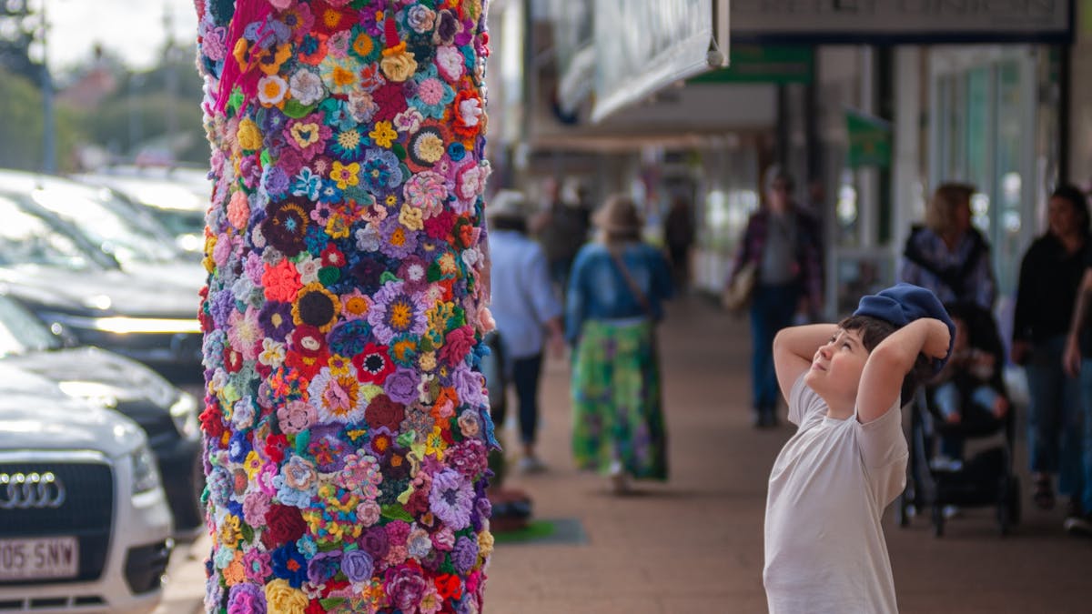 Child enjoying the wonder of the Tree Jumper installation