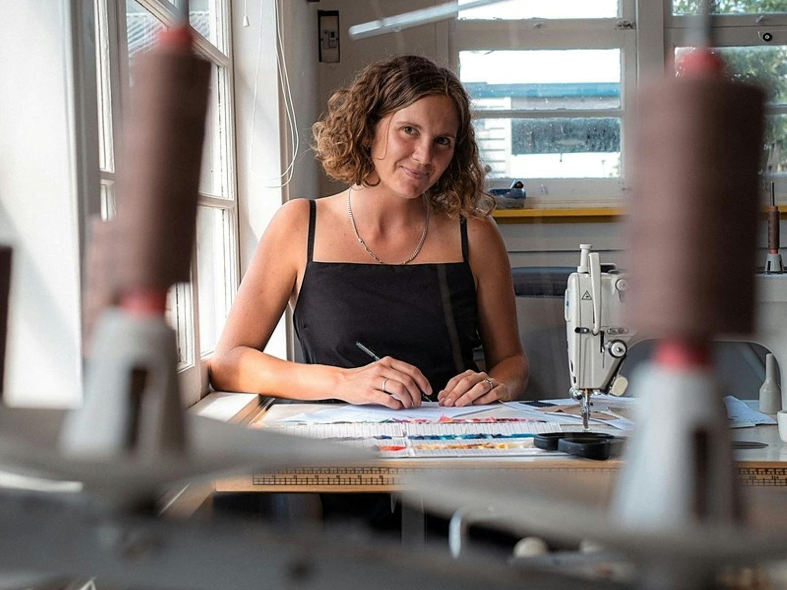 Image of a woman sewing