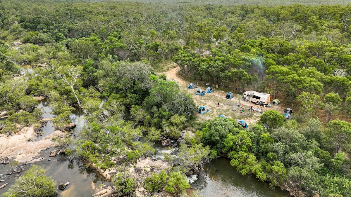 truck and tents camping by river