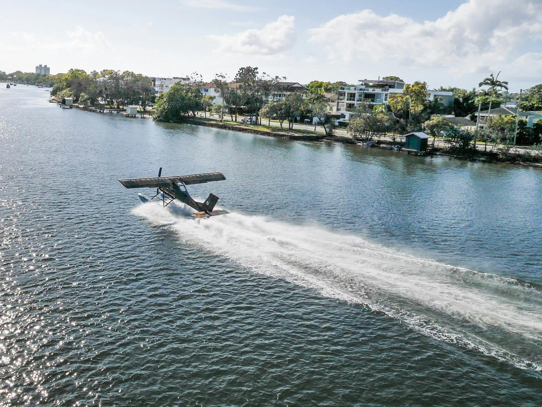 Wilga 80 Seaplane takes off from Maroochy River Queensland.