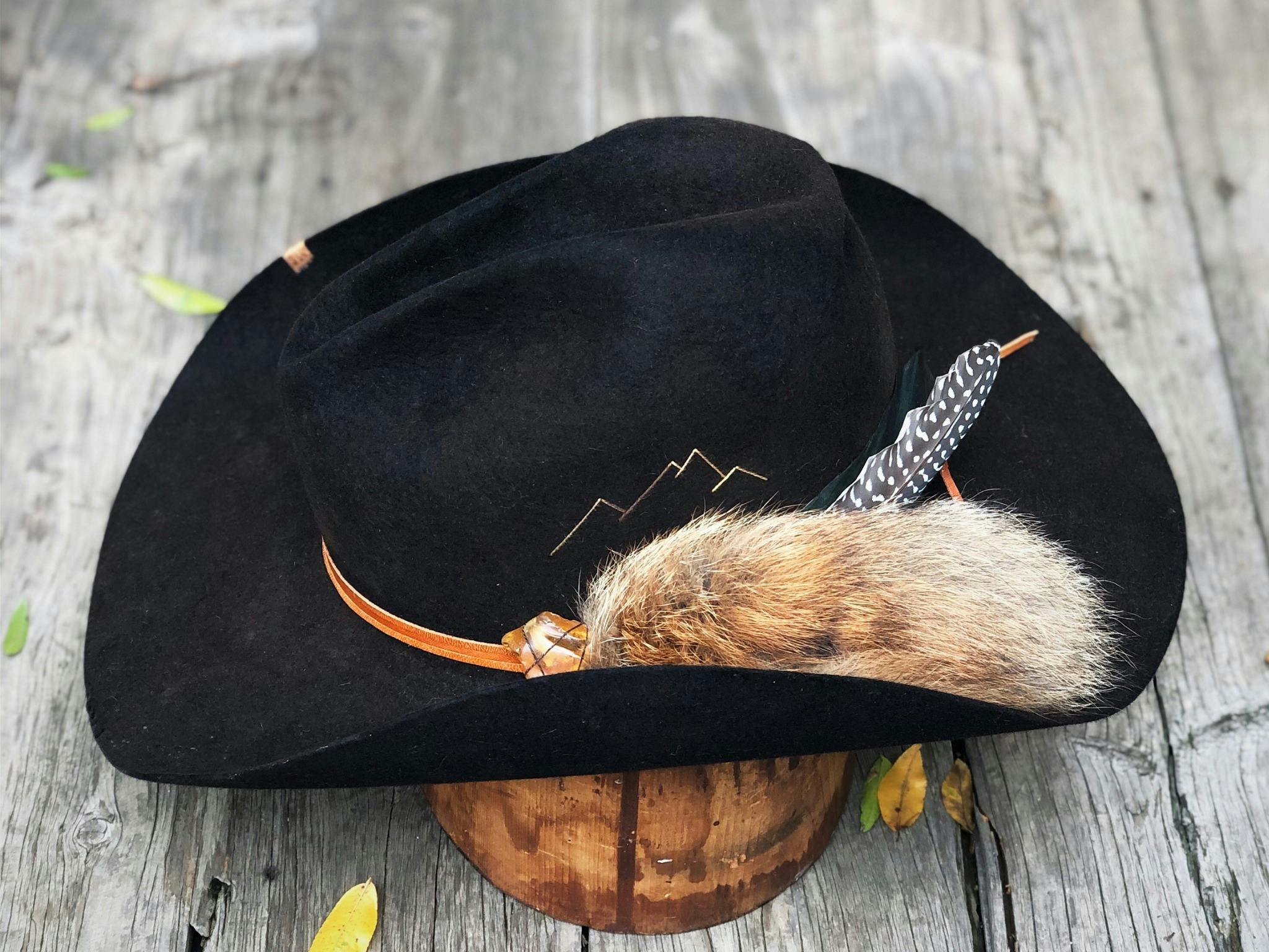 brimmed hat with feather