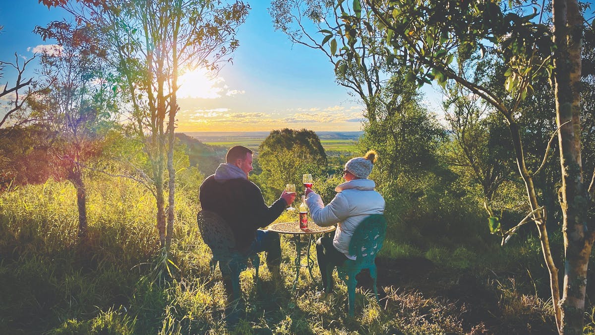 A Couple enjoying the sunset lookout at Kiambram Country Cottages