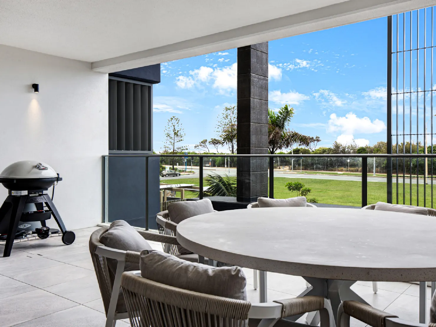 Balcony area with outdoor dining and BBQ