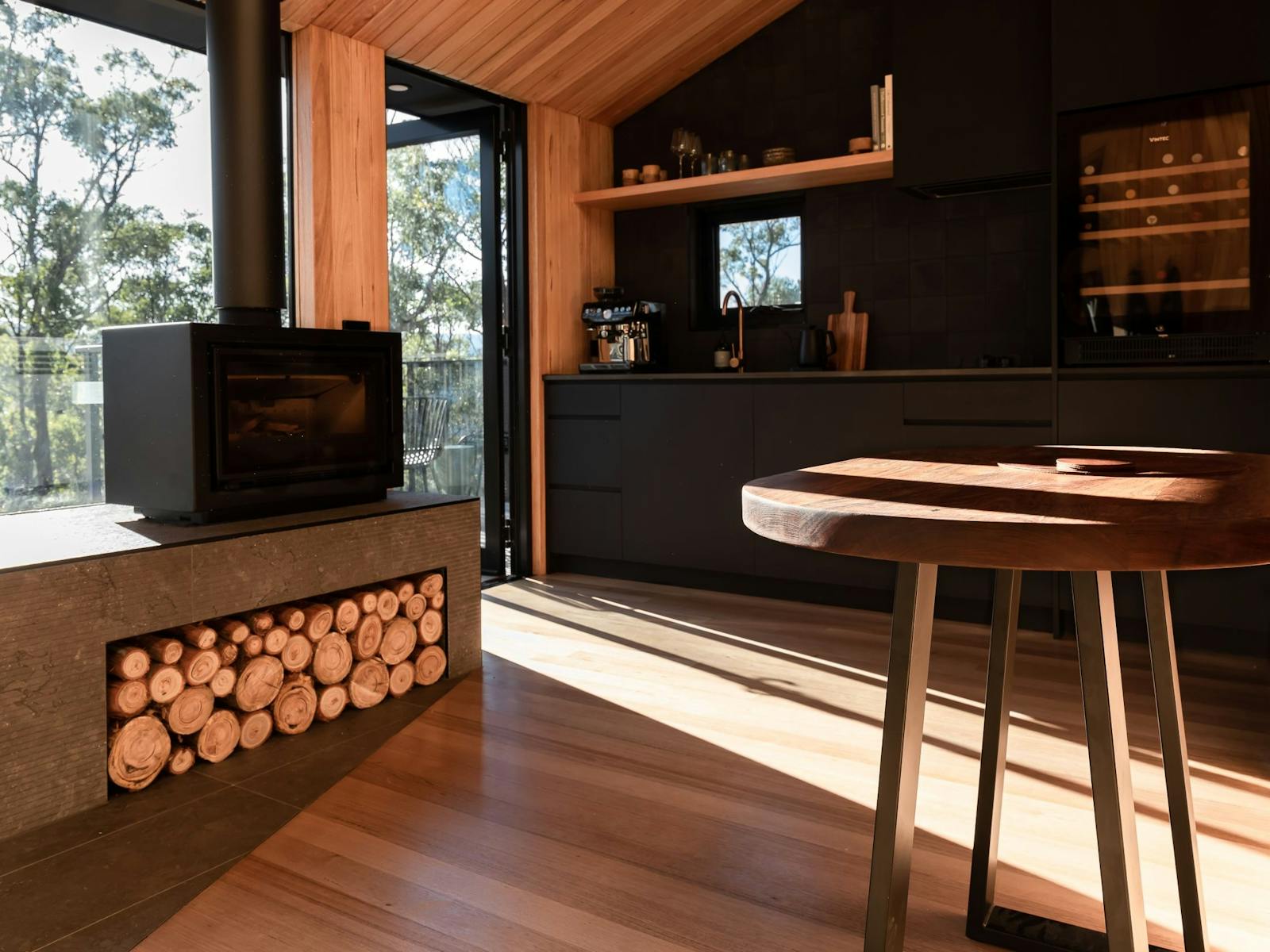 Hunter Huon Valley, charnwood wood fireplace, custom table and kitchenette