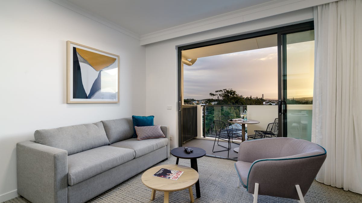 Unwind in your own living area. With balcony, couch, smart TV with Netflix access and dining table.