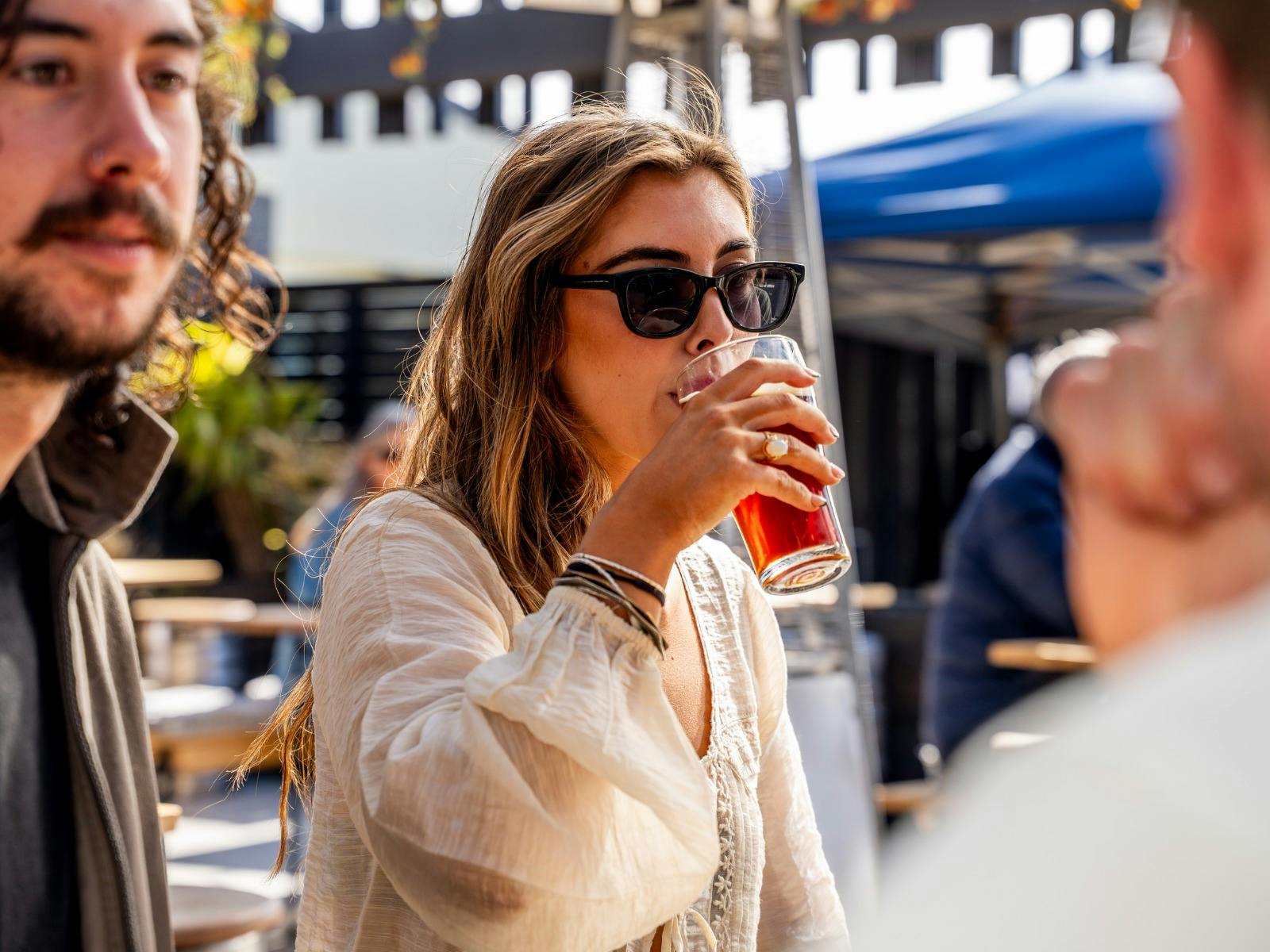 Woman drinking Thirsty Tiger beer at Easy Tiger, St Helens.