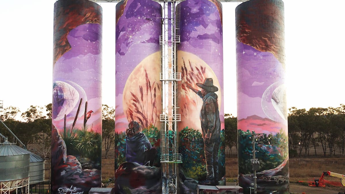 image of the three moon grain silo at day time