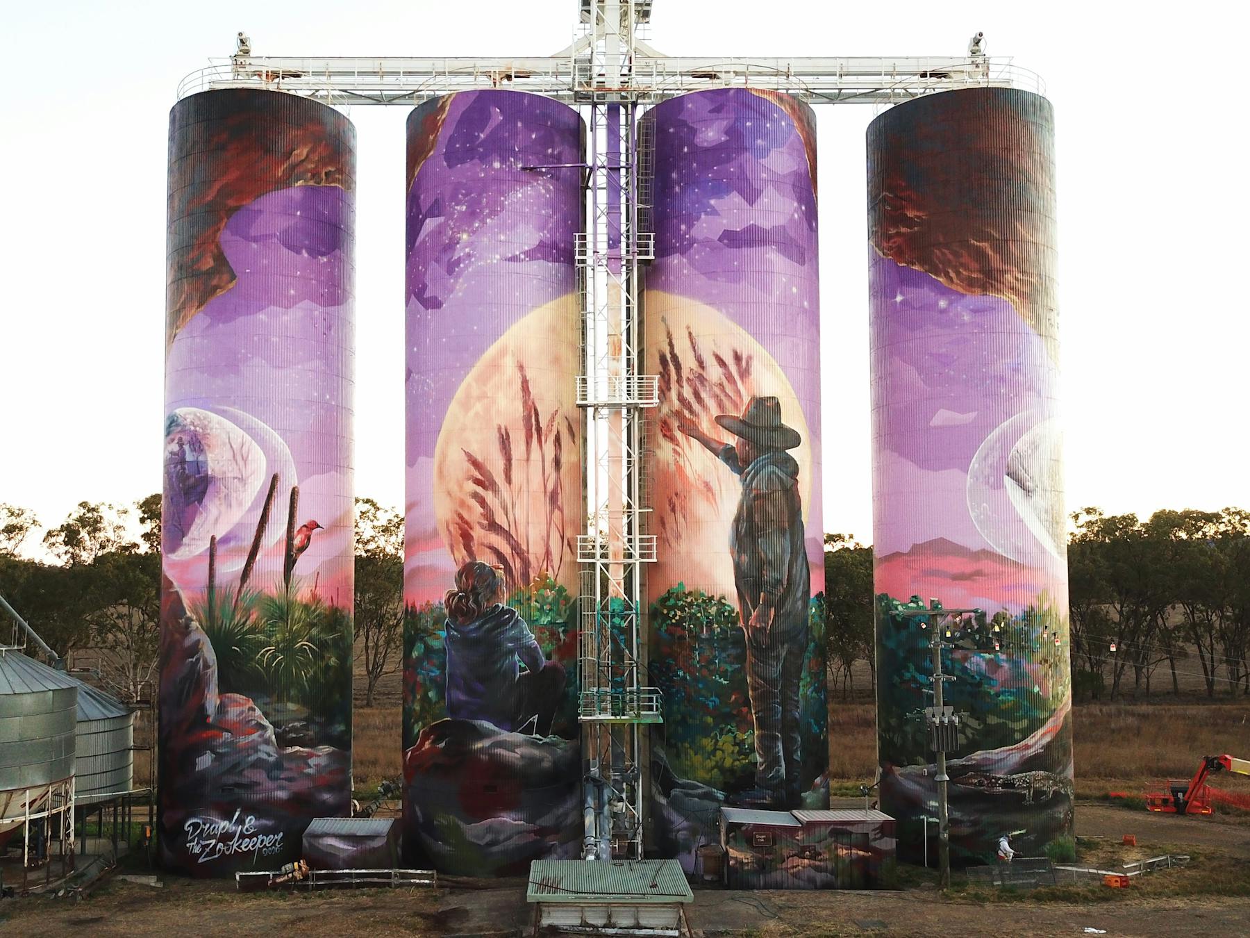 image of the three moon grain silo at day time