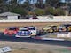 Group of TA2 racing cars going  around Winton Raceway