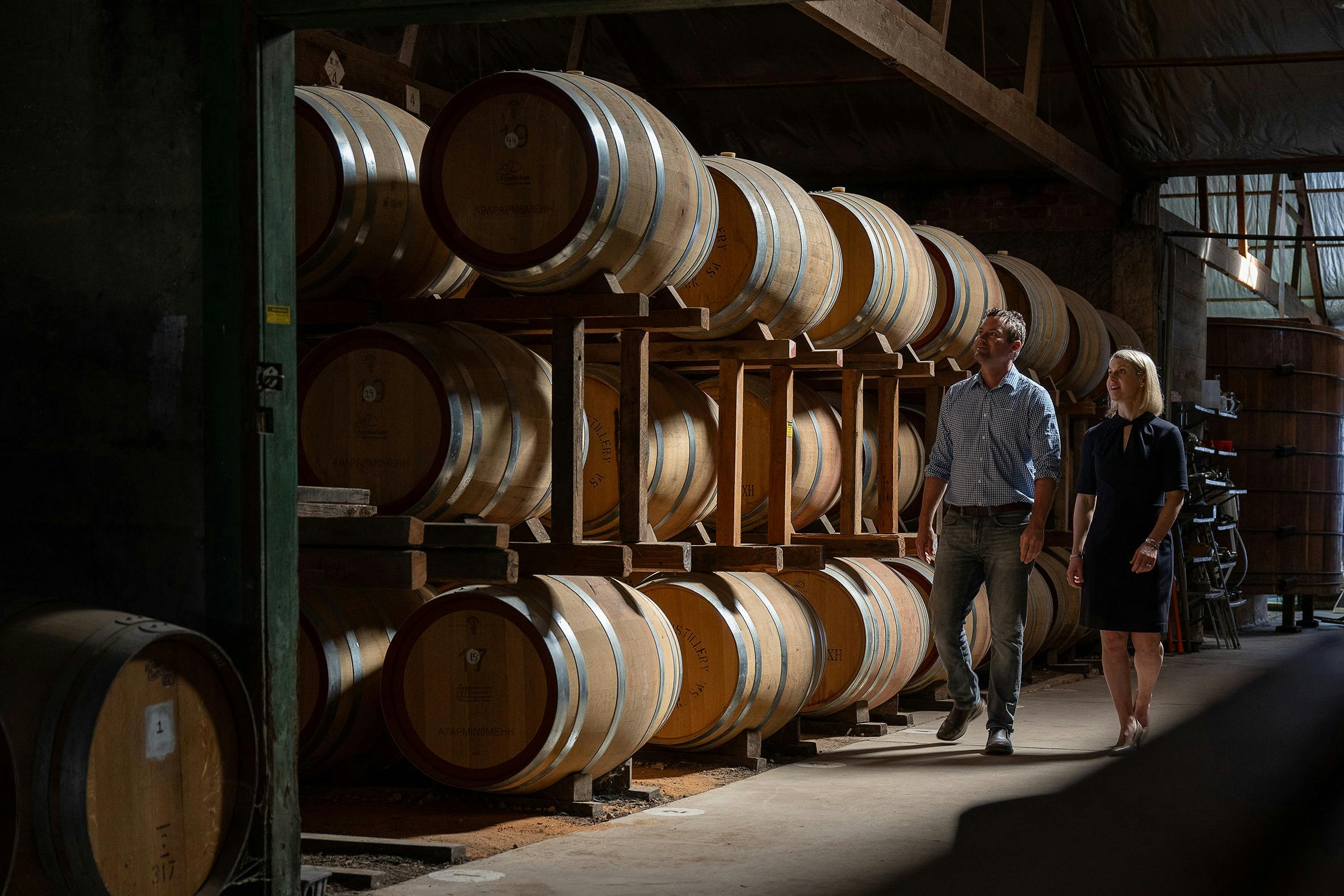 Victoria and Richard Angove walking through the barrel Hall