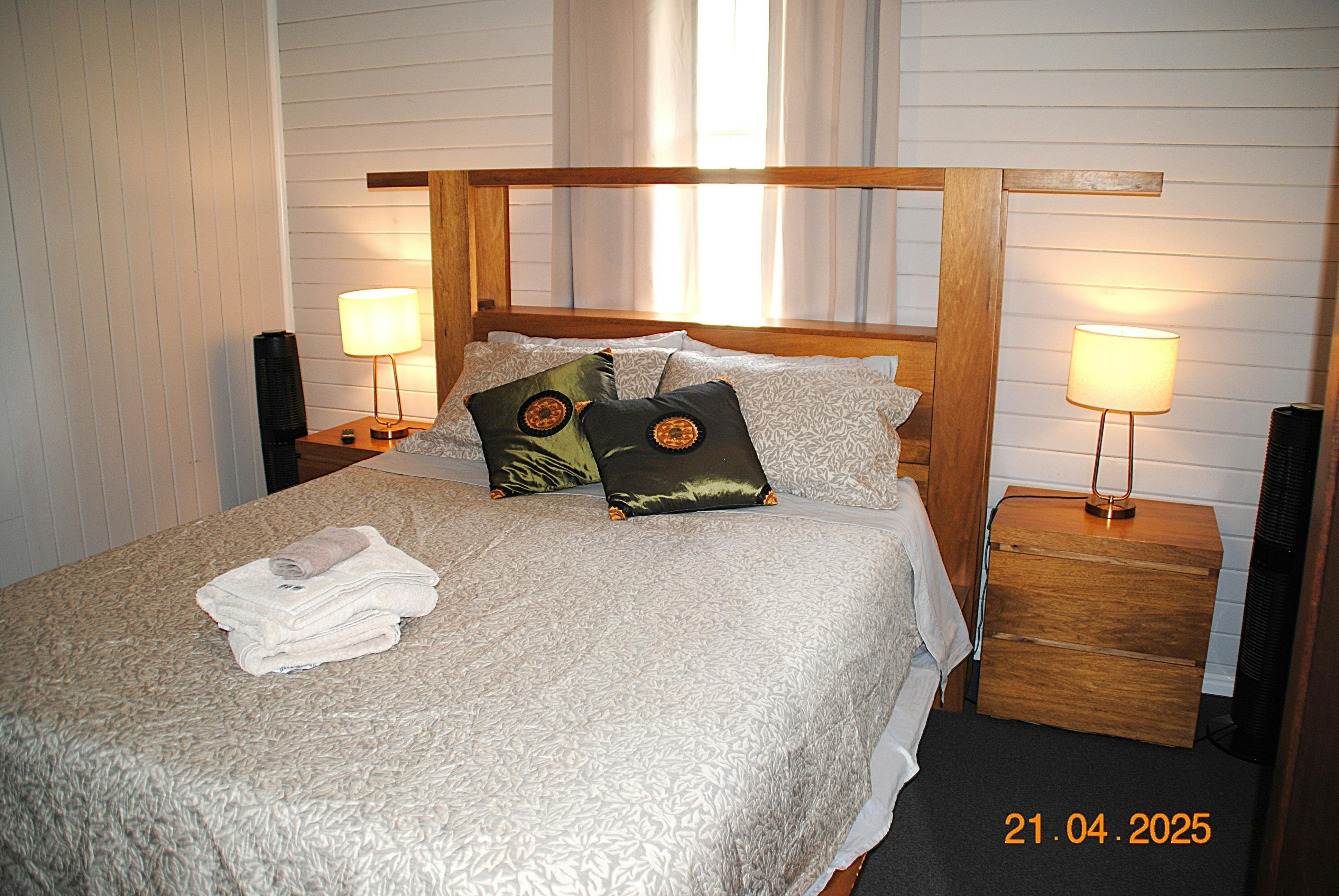 Modern bedroom suite with king bed and plenty of storage space