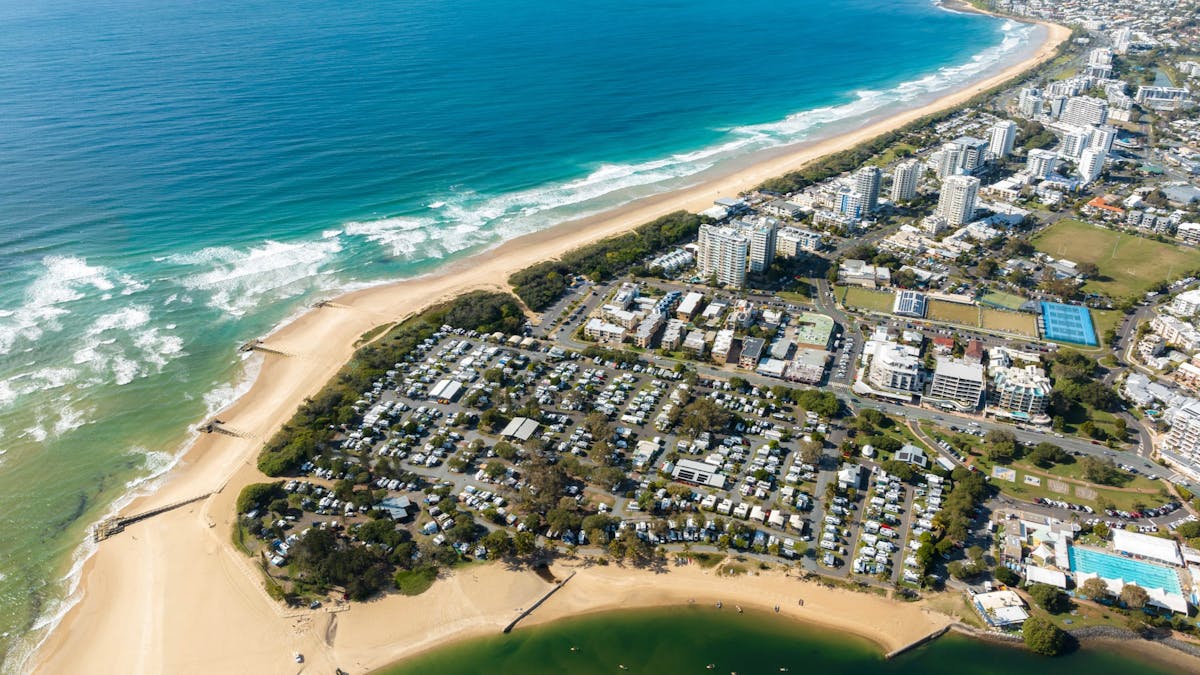 Arial shot of cotton tree holiday park with generous views of the beach and ocean. Arial shot of cotton tree holiday park with generous views of the beach and ocean.