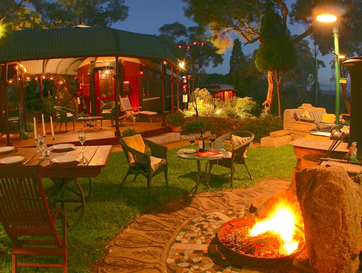 The terrace outside the carriages is an ideal place to dine and relax around the firepit