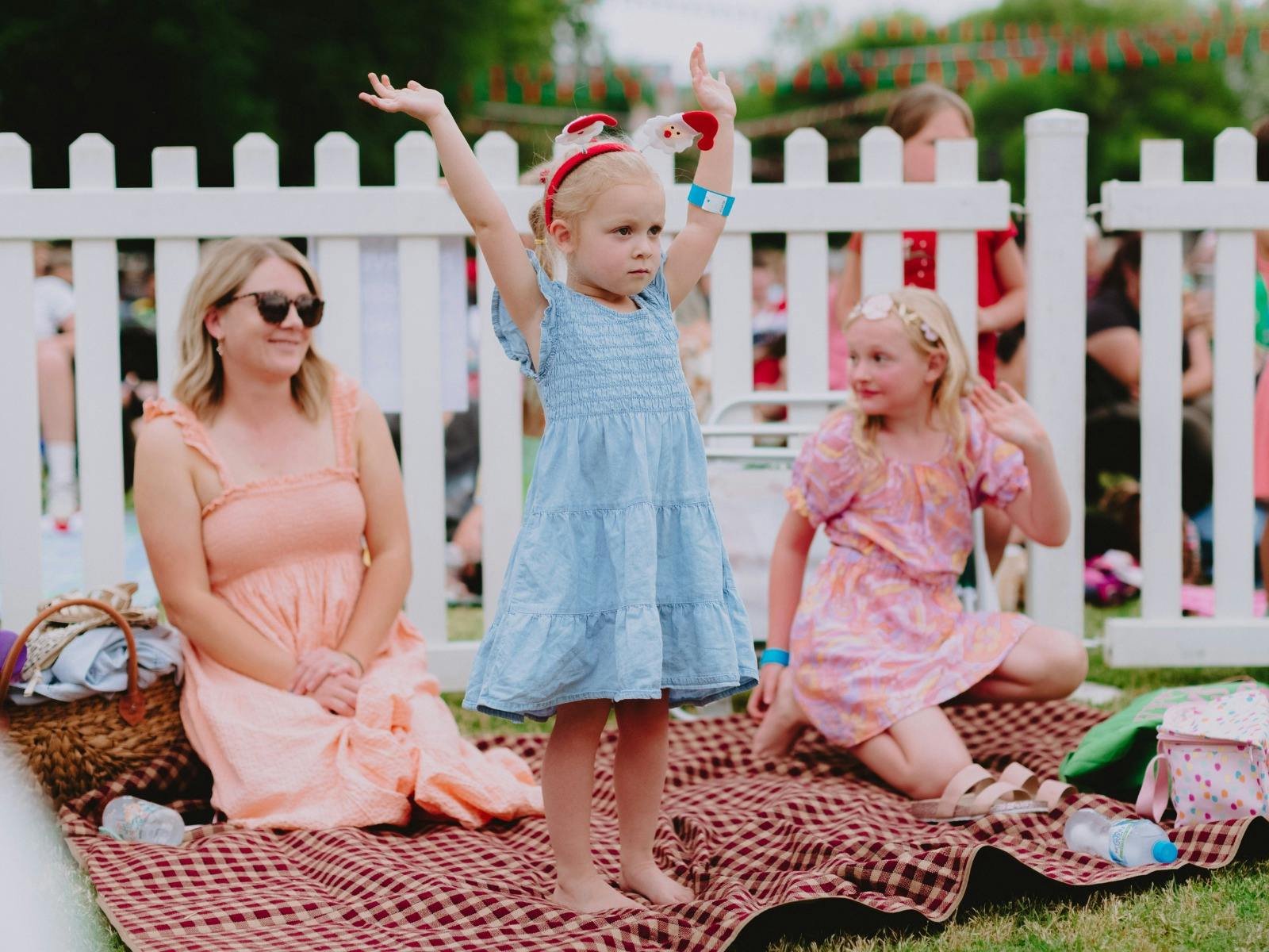 Small children celebrating with their mum,