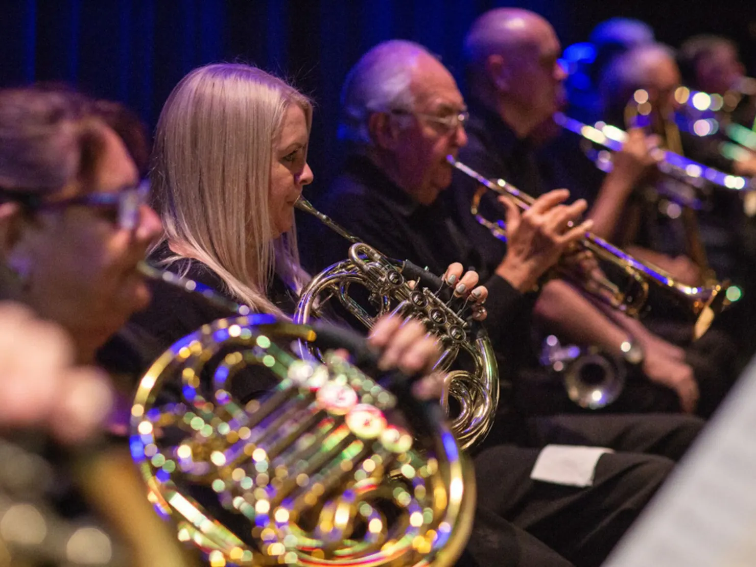 line of performers playing instruments