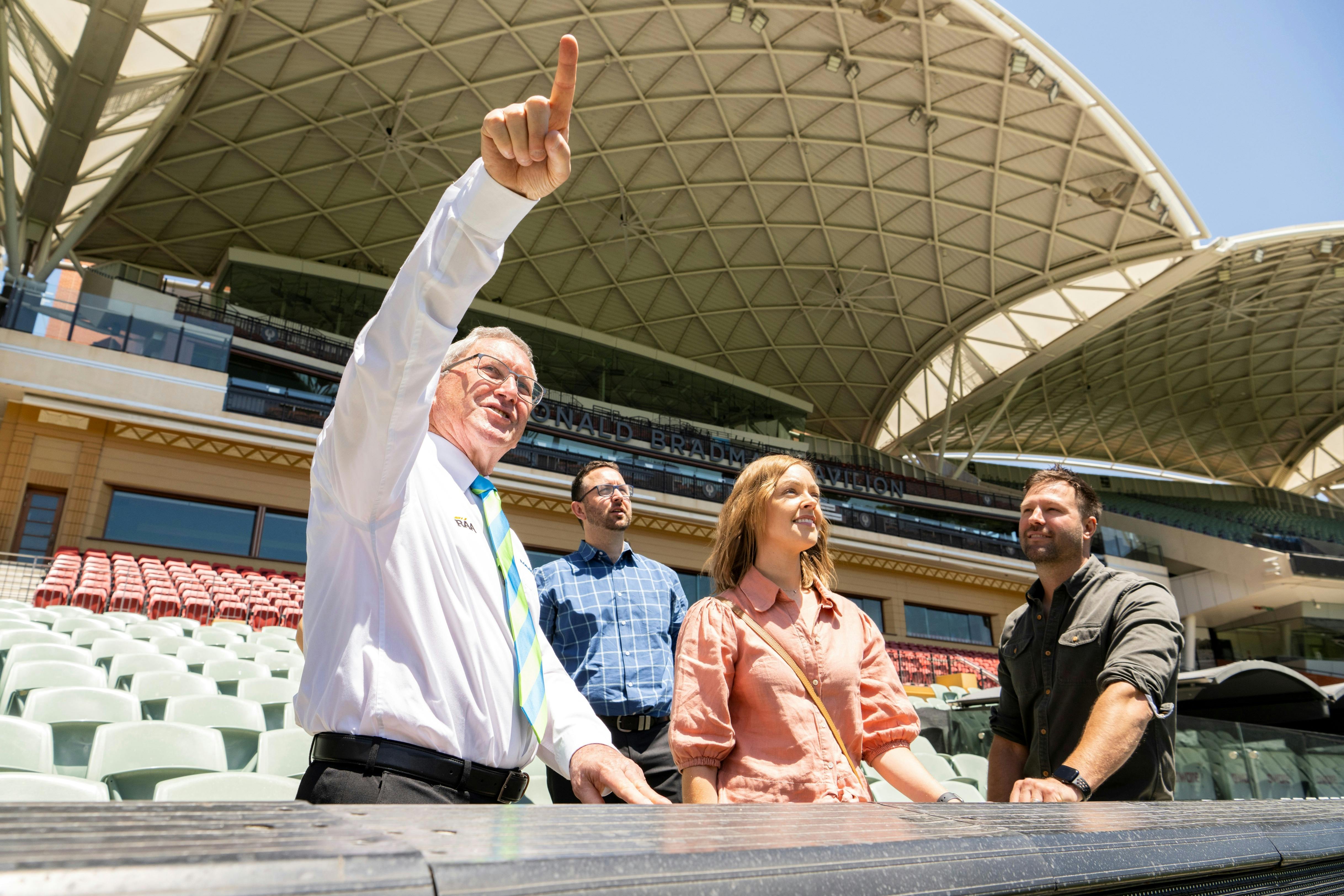 Tour guide speaking with tour group at Adelaide Oval