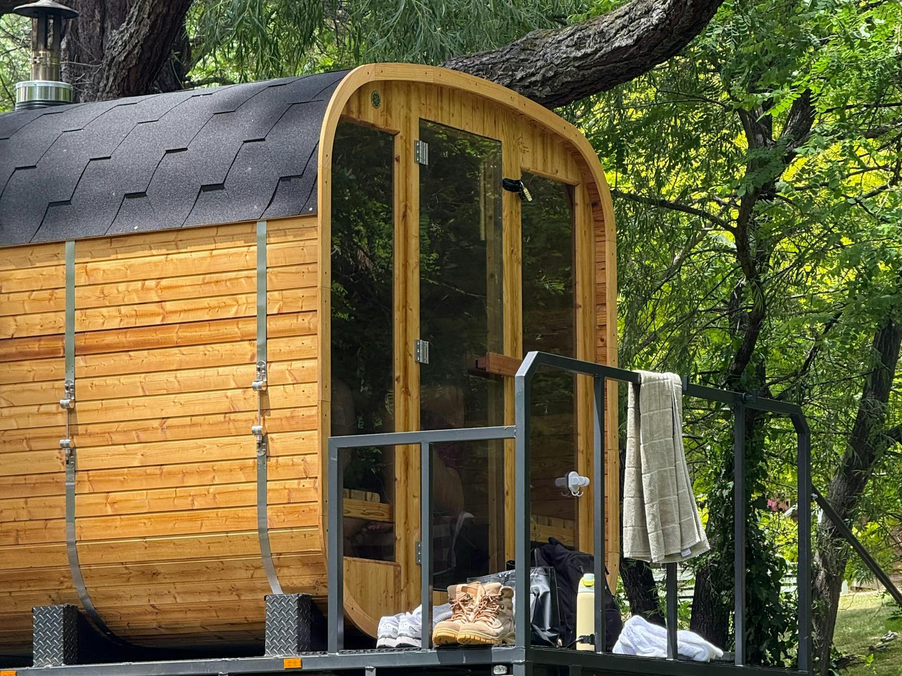 Mobile wood-fired sauna in Bright surrounded by bushland, offering a tranquil outdoor experience