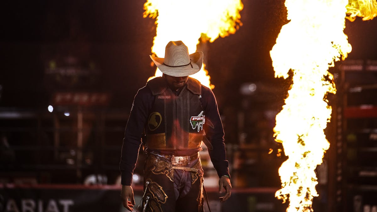 PBR Cowboy walking into arena