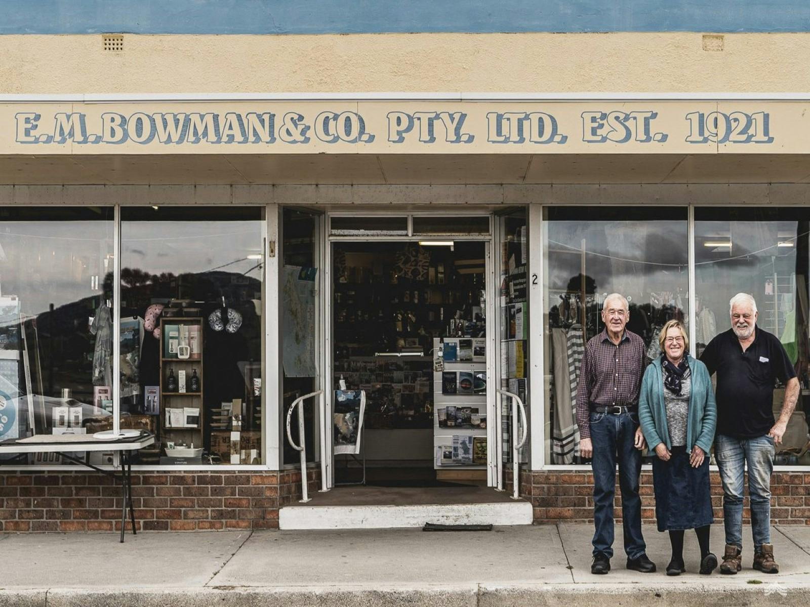 three siblings outside Bowmans Store for the 100 year celebration