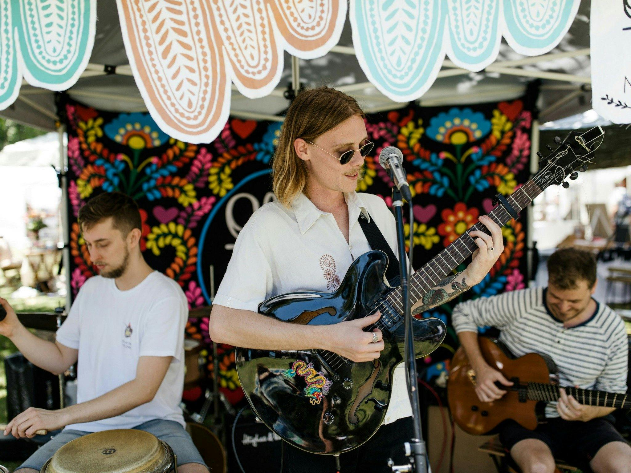 Relax to live music all day at The Olive Tree Market