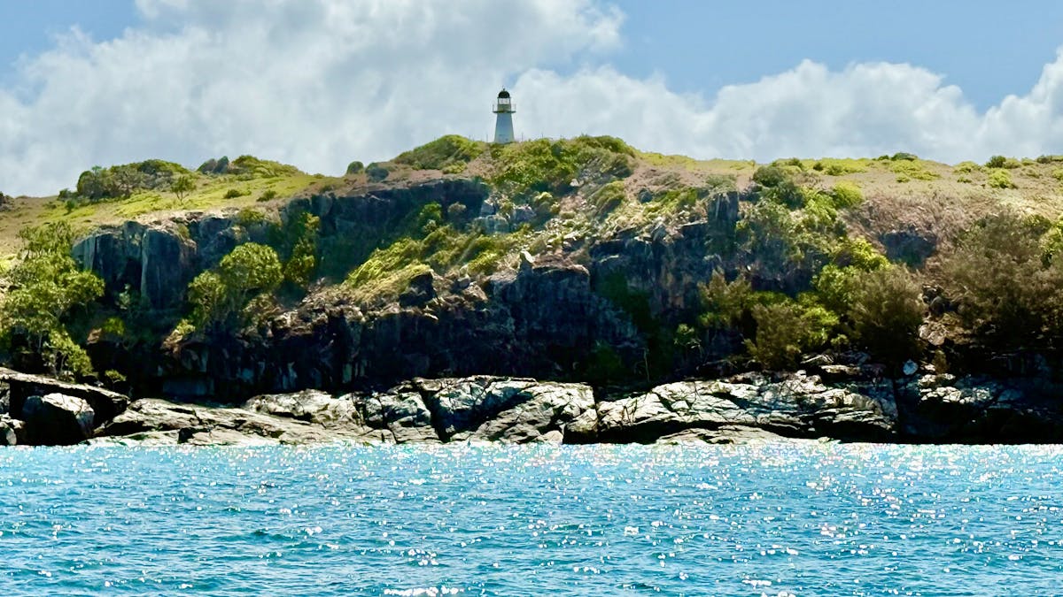 image of lighthouse high on top of Flat Top Island