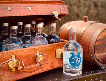 bottles in suitcase with barrel