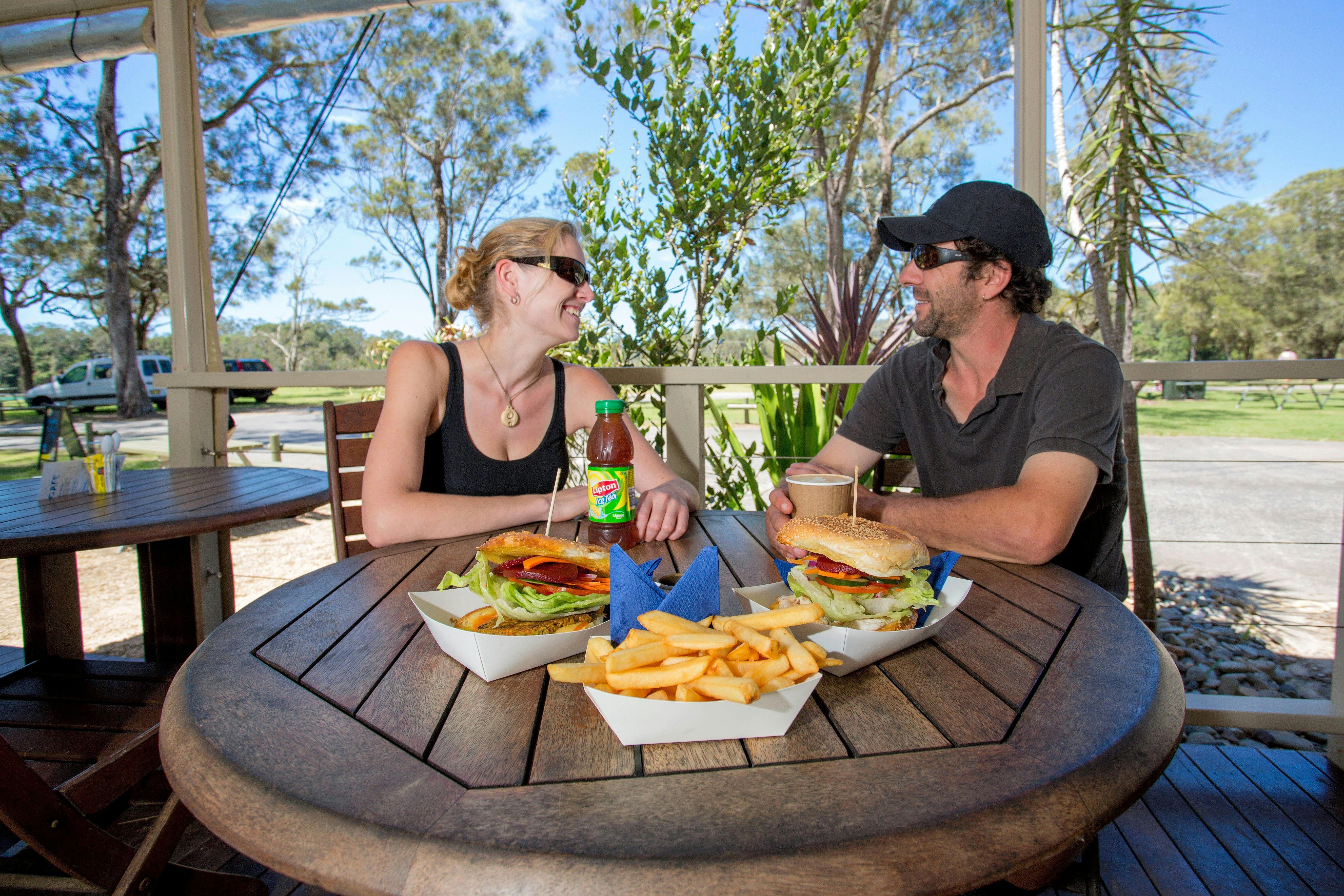 Enjoying a meal at the Boambee Creek Reserve Cafe.