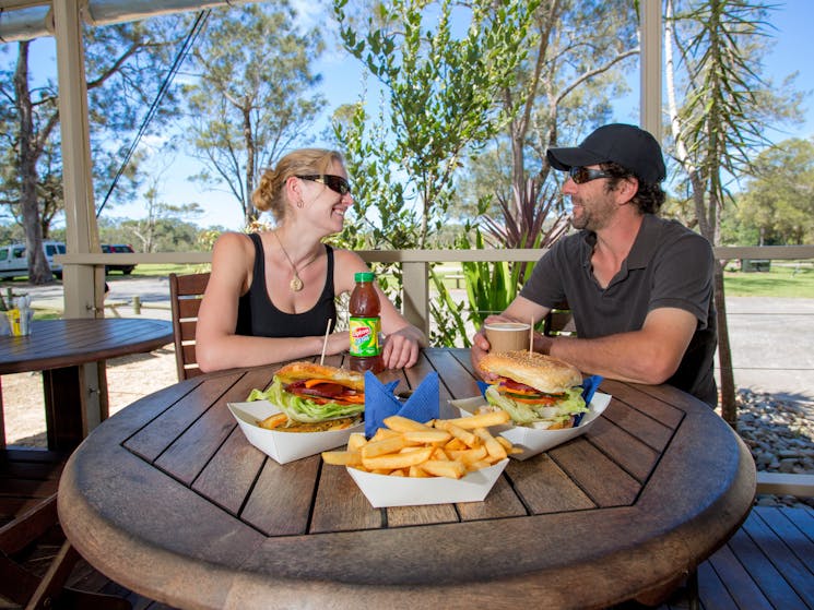 Enjoying a meal at the Boambee Creek Reserve Cafe.