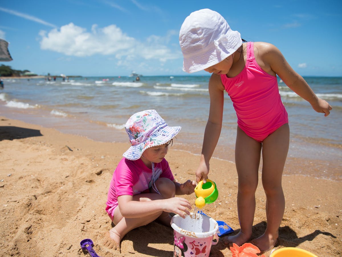 Kids playing on the sand at Suttons Beach